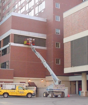 Municipal wildlife control in daytona beach using a lift.